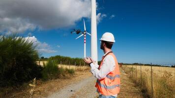 Engineer is using a drone in a wind field photo