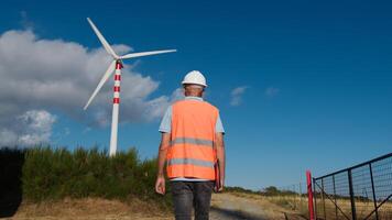 Architect checks the correct functioning of wind turbines photo