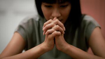 Religious concept. Belief. Close-up. A young woman praying thanks to the holy scriptures. God's teachings based on faith and faith in God, religion, belief, hope, love, praye photo