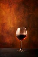 AI generated Elegant glass of red wine on a textured amber background photo