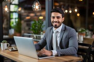 AI generated A smiling businessman sitting on workdesk with a laptop in front. photo