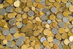 Golden coins texture. Ukrainian hryvnia. Abstract background photo