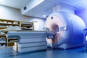 Medical CT or MRI or PET Scan standing in the modern hospital laboratory. Technologically advanced and functional medical equipment in a clean white room. photo