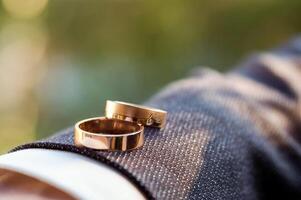 Wedding rings. Wedding symbols. Wedding details of the groom photo