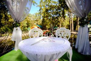 Beautiful wedding decorations for the ceremony outside in sunny weather photo