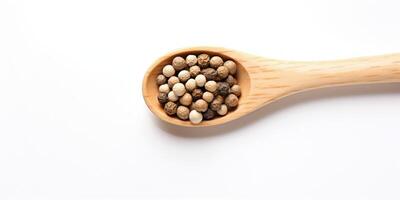 AI Generated White Pepper Pile In Wooden Spoon On White Background. Peppercorn Heap, Organic Seasoning. Top View Of Spice Condiment photo