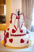 Elegant wedding cake during reception photo