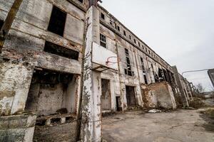 Abandoned factory interior. Old industrial building for demolition photo