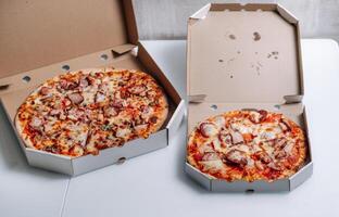 pizza for delivery in cardboard boxes photo