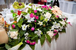 Wedding flowers concept. . Bright colors. Table decorations. Closeup. photo