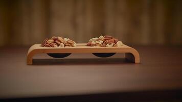 Mixed Nuts of Almonds Pecan Walnuts Cashews Hazelnuts on Wooden Table video