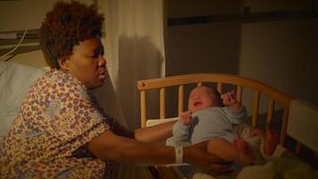 Black Woman with Curly Hair Resting in Delivery Room With Infant Child video