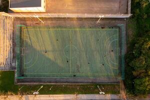 Aerial view of green artificial football field. photo