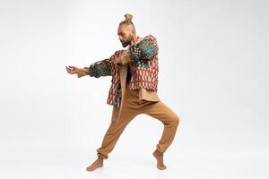 Gay man dancing in photo studio