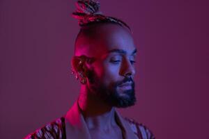 Black man in neon studio light photo