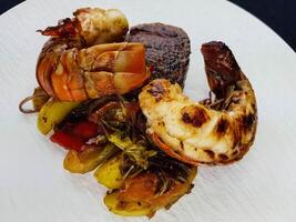 Surf and turf fillet steak and crawfish photo