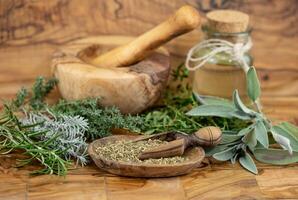 Herbs from French Provence on olive wood photo