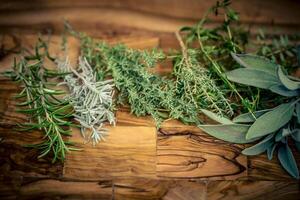 Herbs from French Provence on olive wood photo
