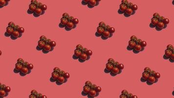 Pattern with many tomatos animated on red background. Tomatos move in different directions. 4K video