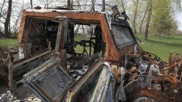 A burnt and destroyed armored car of the Russian army as a result of a battle with Ukrainian troops near Kyiv. Russian aggression in Ukraine. Ukraine is waging a liberation war with Russia. video