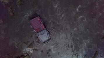 The SUV got stuck in a swamp. Top view video