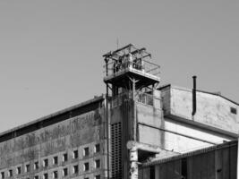 abandoned factory ruins in black and white photo