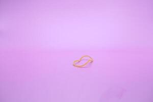 Rubber band isolated in the middle of a purple background photo