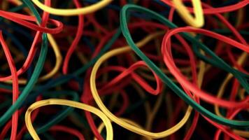 Multi colored rubber bands in flight. On a black background. Filmed on a high-speed camera at 1000 fps. video