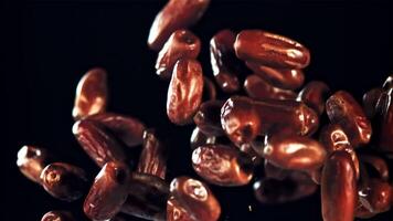 Dates rise up and rotate in flight. On a black background. Filmed on a high-speed camera at 1000 fps. video