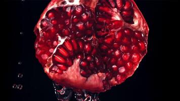 Fresh juice runs down the pomegranate. Filmed on a high-speed camera at 1000 fps. High quality FullHD footage video