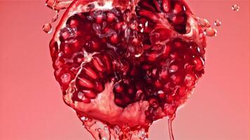 Fresh juice runs down the pomegranate. Filmed on a high-speed camera at 1000 fps. High quality FullHD footage video