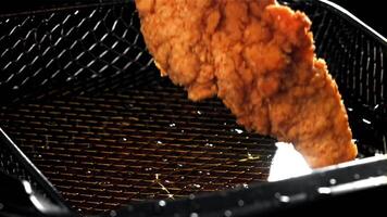 Chicken nuggets fall into hot oil. Filmed on a high-speed camera at 1000 fps. High quality FullHD footage video