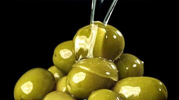 Olive oil is poured over fresh olives. Filmed on a high-speed camera at 1000 fps. High quality FullHD footage video