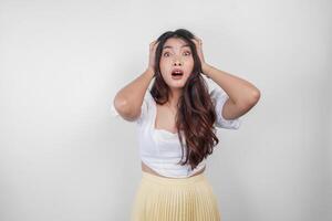 A sad Asian woman looks stressed and depressed, isolated white background. photo