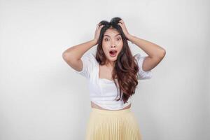 A sad Asian woman looks stressed and depressed, isolated white background. photo