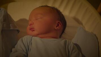 Young Male Infant Child Lying in Crib After Birth video