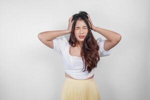 A sad Asian woman looks stressed and depressed, isolated white background. photo