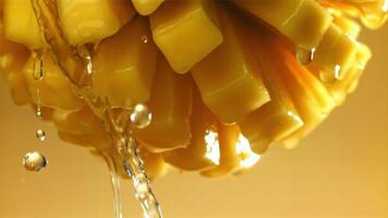 Drops of water drip from fresh mango. Filmed on a high-speed camera at 1000 fps. High quality FullHD footage video