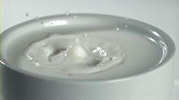 Splashes from a drop of milk. Filmed on a high-speed camera at 1000 fps. High quality FullHD footage video