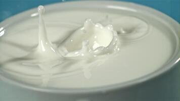 Splashes from a drop of milk. Filmed on a high-speed camera at 1000 fps. High quality FullHD footage video