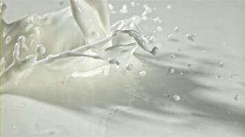 Fresh milk with splashes. Filmed on a high-speed camera at 1000 fps. High quality FullHD footage video