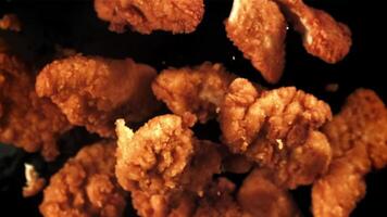 Chicken nuggets fly up and fall down. Filmed on a high-speed camera at 1000 fps. High quality FullHD footage video