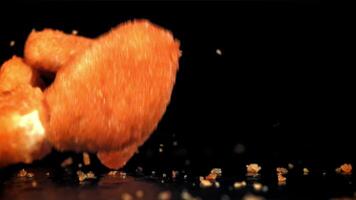 Chicken nuggets fall on the table. Filmed on a high-speed camera at 1000 fps. High quality FullHD footage video