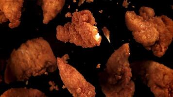 Chicken nuggets fly up and fall down. Filmed on a high-speed camera at 1000 fps. High quality FullHD footage video