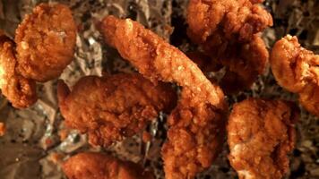 Chicken nuggets fly up and fall down. Filmed on a high-speed camera at 1000 fps. High quality FullHD footage video