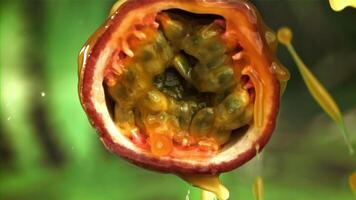 Fresh passion fruit with a splash of juice. Filmed on a high-speed camera at 1000 fps. High quality FullHD footage video