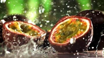 Raindrops fall on tropical passion fruit. Filmed on a high-speed camera at 1000 fps. High quality FullHD footage video