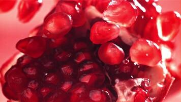 Pomegranate seeds fall on a piece. Filmed on a high-speed camera at 1000 fps. High quality FullHD footage video