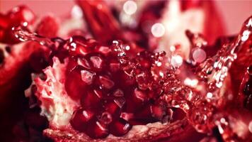 Fresh juice runs down the pomegranate. Filmed on a high-speed camera at 1000 fps. High quality FullHD footage video