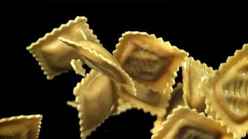 Ravioli fly up and fall down. Filmed on a high-speed camera at 1000 fps. High quality FullHD footage video